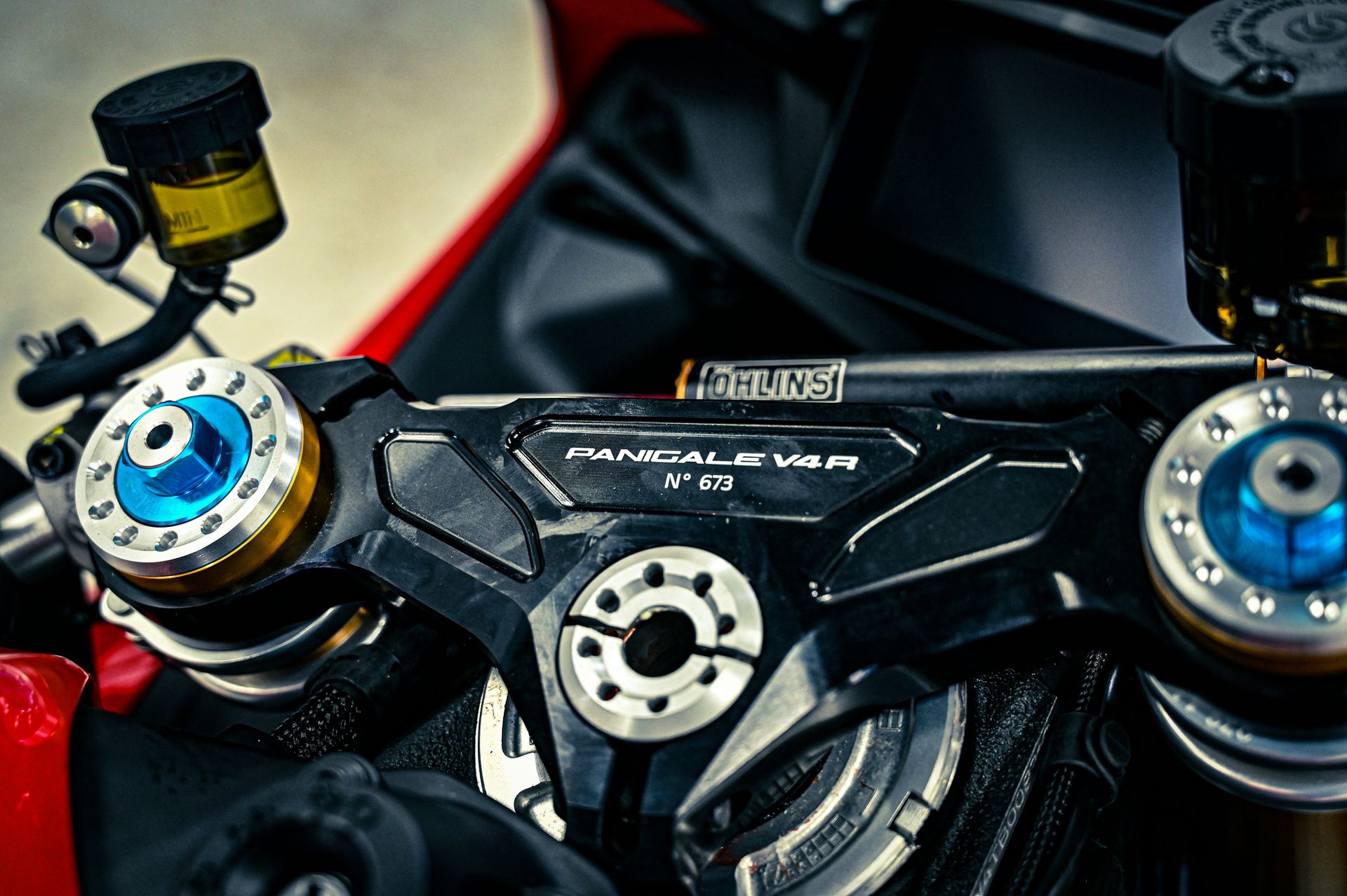 Ducati panigale v4r motorcycle handlebars and front suspension details.
